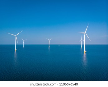 Offshore Windmill farm in the ocean  Westermeerwind park , windmills isolated at sea on a beautiful bright day Netherlands Flevoland Noordoostpolder