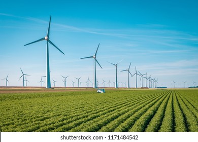 Offshore Windmill Farm In The Ocean  Westermeerwind Park , Windmills Isolated On A Beautiful Bright Day Netherlands Flevoland Noordoostpolder