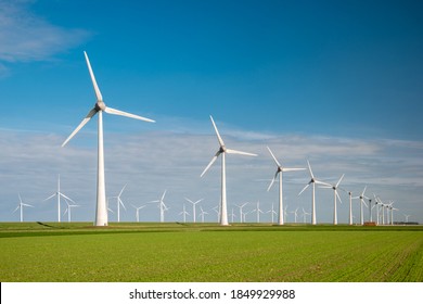 Offshore Windmill Park With Clouds And A Blue Sky, Windmill Park In The Ocean Drone Aerial View With Wind Turbine Flevoland Netherlands Ijsselmeer