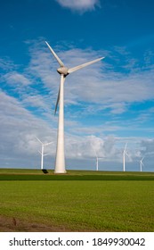 Offshore Windmill Park With Clouds And A Blue Sky, Windmill Park In The Ocean Drone Aerial View With Wind Turbine Flevoland Netherlands Ijsselmeer