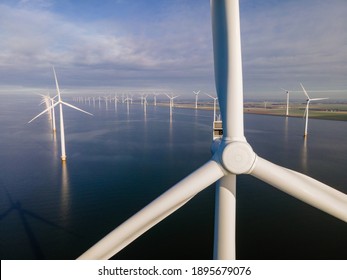 Offshore Windmill Park With Clouds And A Blue Sky, Windmill Park In The Ocean Drone Aerial View With Wind Turbine Flevoland Netherlands Ijsselmeer