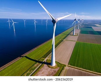 Offshore Windmill Park With Clouds And A Blue Sky, Windmill Park In The Ocean Aerial View With Wind Turbine Flevoland Netherlands Ijsselmeer. Green Energy 