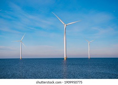 offshore windmill park with stormy clouds and a blue sky, windmill park in the ocean. Netherlands . Europe, windmill turbines in ocean with blue sky, green energy concept