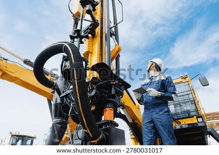 Offshore worker inspect with tablet drilling rig for exploration of minerals for oil, gas and artisan water. Concept smart online Industry.