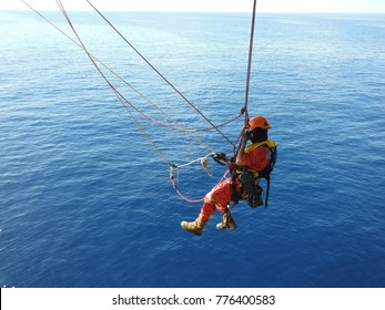 Offshore Worker  Using Rope Access Of Piping Inspection.