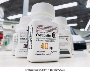 Ogden Utah USA: October 27,2020- OxyContin bottle on counter. Purdue pharma manufacturer has been in a legal battle on their influence in the opioid epidemic.