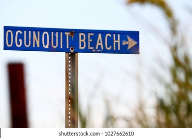 Ogunquit, Maine, USA: August 18, 2017: A focused shot of a vintage direction metal sign that reads Ogunquit Beach with an arrow pointed screen right.  Ogunquit beach is a popular destination.