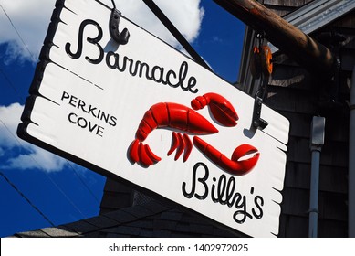 Ogunquit, ME, USA August 12 A Sign Advertising A Local Seafood Restaurant Hangs Over A Local Lobster Shack In Ogunquit, Maine