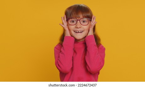 Oh My God, Wow. Young Preteen Child Girl Kid Looking Surprised At Camera With Big Eyes, Shocked By Sudden Victory, Game Winning Lottery Goal Achievemen Good News. Toddler Children On Yellow Background