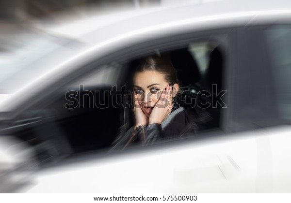 Oh, no! I\
hit someone with my car. Woman surprised while driving. Beautiful\
blonde woman driving her\
automobile.