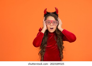 Oh No. Trick Or Treat. Celebrate The Holidays. Childhood. Happy Halloween Devil Girl. Teenage Child In Imp Horns. Cheerful Kid Wear Funny Party Glasses. Time To Have Fun. Carnival Costume Party