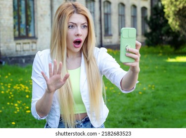 Oh No! Young Woman Shocked By The News, Talking On A Video Link Through Her Smart Phone.