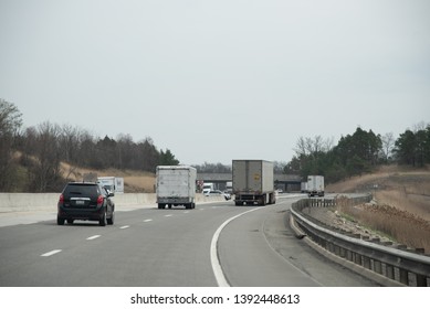 Ohio Turnpike 80/USA - April 17 2019: State Of Ohio Highway Patrol Hiding Behind Center Barrier On The Interstate Waiting For People Who May Be Breaking The Law.