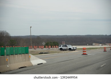 Ohio Turnpike 80/USA - April 17 2019: State Of Ohio Highway Patrol Hiding Behind Center Barrier On The Interstate.