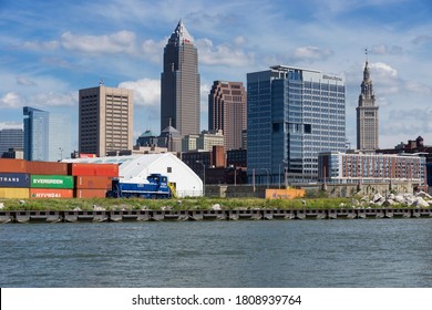 Сleveland, Ohio USA - September 3, 2020: Increased shipping container business and a railroad switcher locomotive are a welcome part of the scene at the busy Port of Cleveland, Ohio