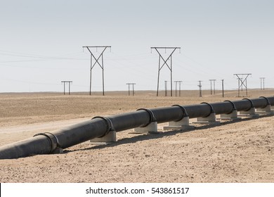 Oi, Gas Or Water Pipeline And Electricity Pylons In The Namib Desert, Concept For Energy Transmission, Namibia, Africa