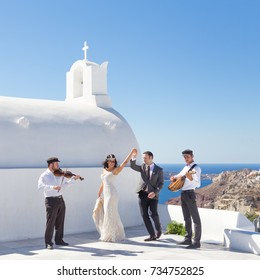 Oia, Santorini Island, Greece - Oct 11, 2017: Bride And Groom Dancing During Wedding Ceremony With Traditional Musicians And Singers On Santorini Island On 11th Of October, 2017 On Santorini, Greece.