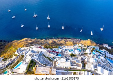 Oia town on Santorini island, Greece. Traditional and famous houses and churches with blue domes over the Caldera, Aegean sea