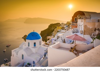 Oia views, an iconic sunset feature of the Greek island of Santorini in Cyclades Archipelago, Aegean Sea, Greece. - Shutterstock ID 2203750687