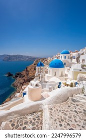 Oia village with churches against Aegean sea on Santorini island in Greece - Shutterstock ID 2247996579