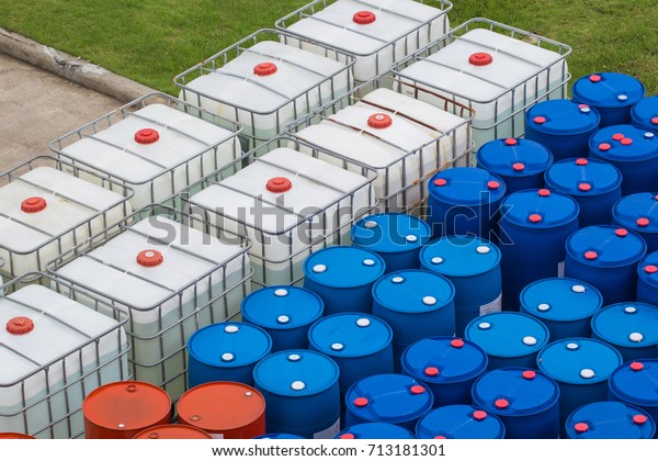 Oil\
barrels blue and white or chemical drums stacked\
up