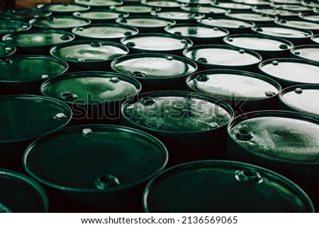 Oil barrels green or chemical drums vertical stacked up the industry