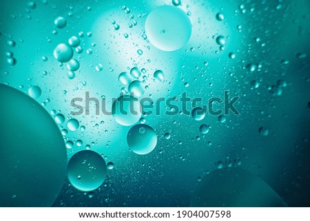 oil with bubbles on dark blue background. Abstract space background. Soft selective focus. macro of oil drops on water surface. copy space. air bubbles in water