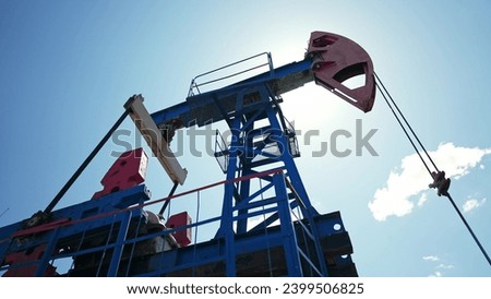 oil business. oil pump pumps out of the ground resource extraction. industry business oil and gas concept. energy rig petroleum mechanism barrel concept. oil pump works in production business