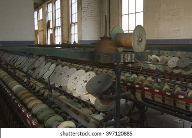 Oil can and empty thread spools in turn of the century silk throwing factory.