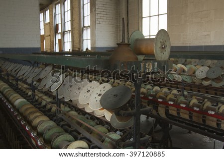 Oil can and empty thread spools in turn of the century silk throwing factory.