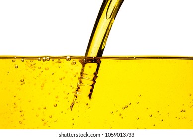 Oil car motor or vegetable oil pouring with bubble isolated on white background 