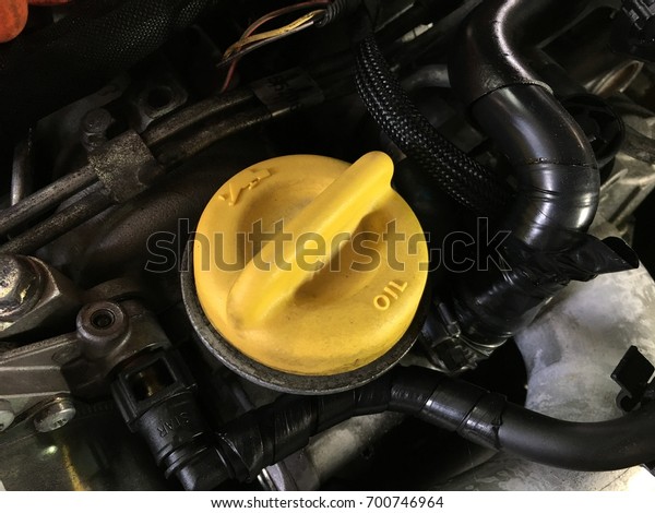 Oil change\
in your car - yellow oil filler cap\
car