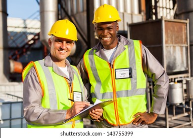 Oil And Chemical Co-workers In Refinery Plant