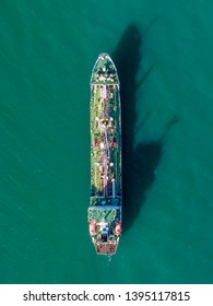 Oil Container Ship On A Green Sea Ocean With Shadow No People And Copy Space Aerial Ariel Drone Uav Birds Eye Top Down View 