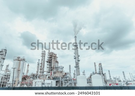 Oil cracking refinery complex with tankage, distillation unit, steam, power, water-treatment plants, gas flare or flare stack clouds of exhaust fumes in San Antonio, Texas, gasoline production. USA