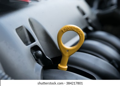 The Oil Dipstick Of A Car Engine