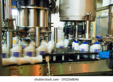 Oil Is Dispensed Into Quart Bottles At A Lubricant Manufacturing Facility