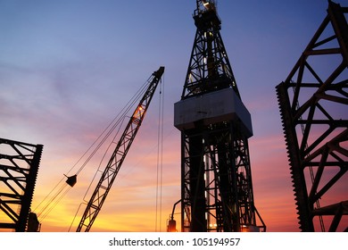 Oil Drilling Platform In The Evening