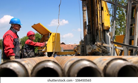 Oil drilling rig workers lifting drill pipe.
Oil and Gas Industry. Drilling Rig. Oil and Gas Worker.