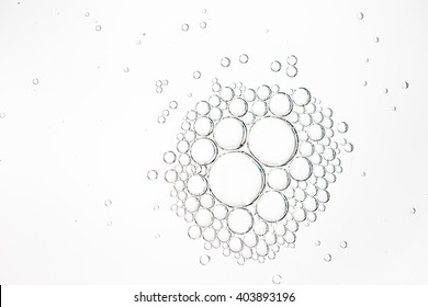 Oil Drops In Water On A White Background