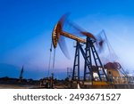 Oil field, In the evening of oilfield derrick
