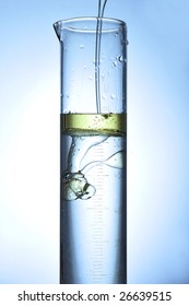 Oil Flowing In A Taste Tube With Water