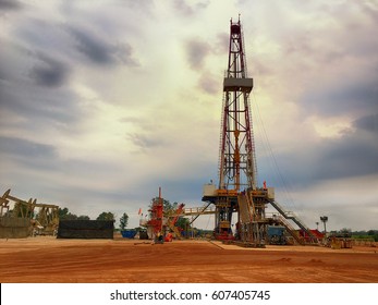 Oil And Gas Drilling Rig Onshore Dessert With Dramatic Cloudscape