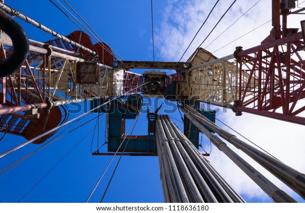 Oil and Gas Drilling\
Rig. Oil drilling rig operation on the oil platform in oil and gas\
industry.