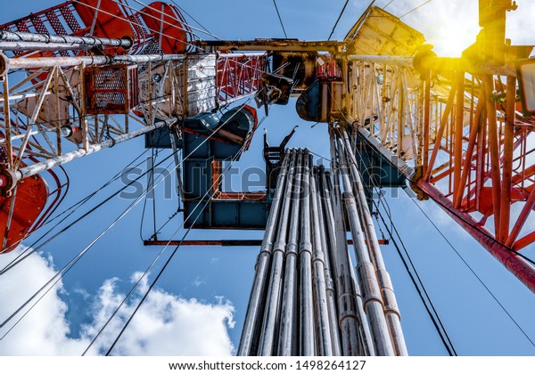 Oil and Gas Drilling\
Rig. Oil drilling rig operation on the oil platform in oil and gas\
industry