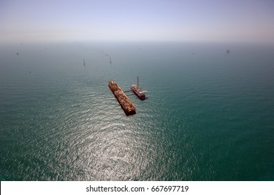 Oil And Gas Exploration In The Persian Gulf. Aerial View Of A Rig In The Arabian Sea