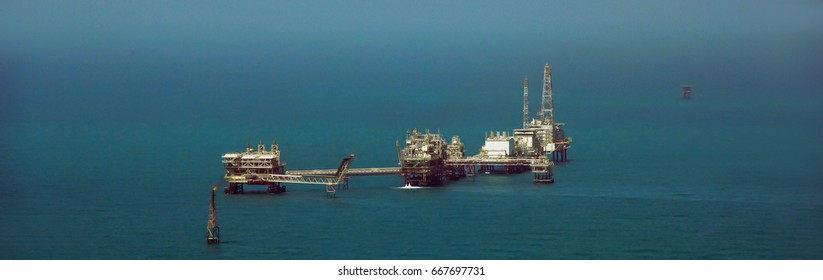 Oil And Gas Exploration In The Persian Gulf, Middle East Panoramic Aerial View On An A Rig In The Arabian Sea.