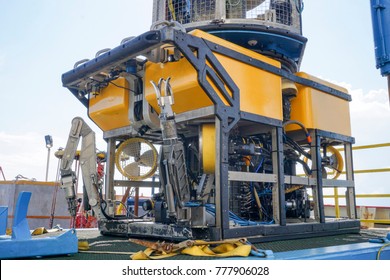 Oil and gas industrial. A commercial Remote Operated Vehicle (ROV) for deep sea survey purpose standby on the mini platform awaiting for launching to the sea.