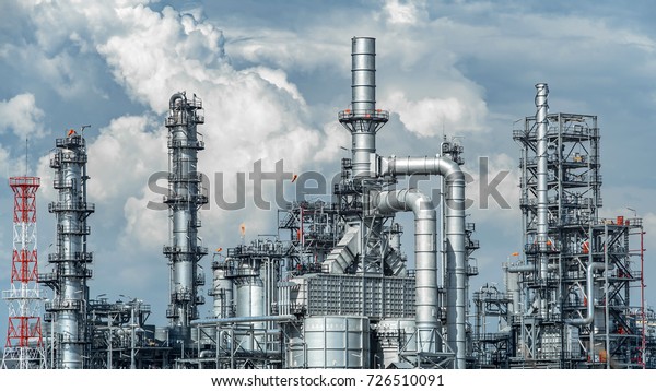 Oil and gas industrial,Oil\
refinery plant form industry,Refinery factory oil storage tank and\
pipeline steel with sunset and cloudy sky\
background,Thailand