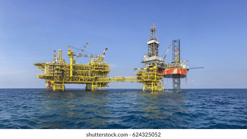 Oil And Gas Industries. Panorama Of Red Jacket Rig Drilling On Top Of Well Head Platform In The Middle Of The Sea. New Oil And Gas Central Processing Platform Installation At North Malay Basin.